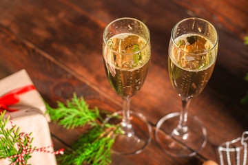 champagne in transparent glasses and a bottle (New Year's atmosphere, Christmas) happy holidays! top. food background. copy space