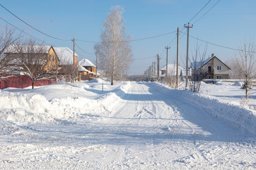 The road in the village in the snow