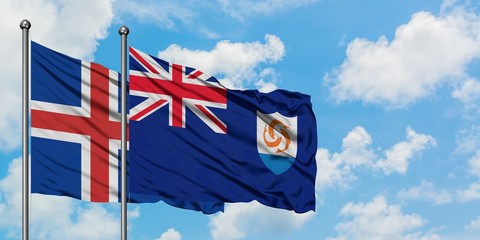 Iceland and Anguilla flag waving in the wind against white cloudy blue sky together. Diplomacy...