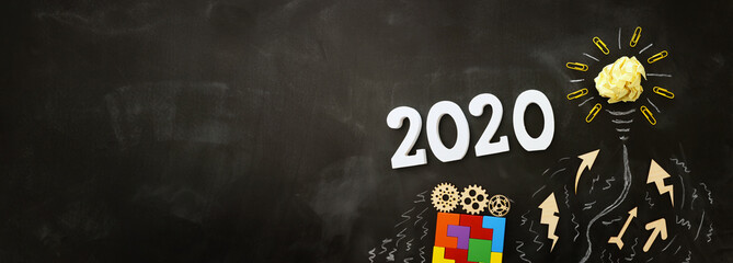 Business concept, top view of blackboard with the phrase 2020