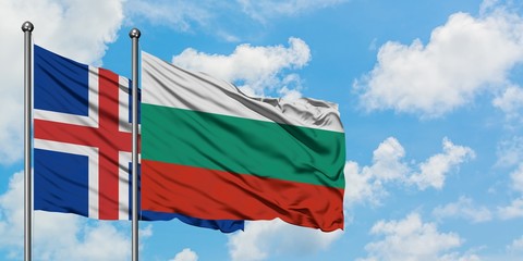 Iceland and Bulgaria flag waving in the wind against white cloudy blue sky together. Diplomacy concept, international relations.