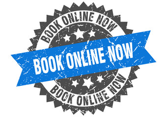 book online now grunge stamp with blue band. book online now