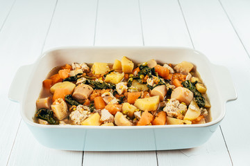 Chicken And Carrots, Parsnips, Potatoes, Peas And Spinach Leaves