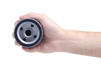 Oil filter for an auto in hand isolated on white background