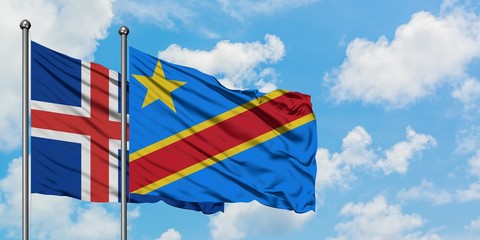 Iceland and Congo flag waving in the wind against white cloudy blue sky together. Diplomacy concept, international relations.