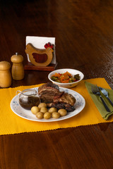 Short beef ribs, roasted with wine and rosemary, served with boiled potatoes and vegetables