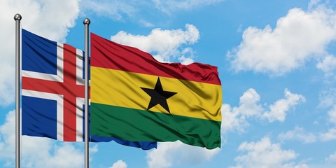 Iceland and Ghana flag waving in the wind against white cloudy blue sky together. Diplomacy concept, international relations.