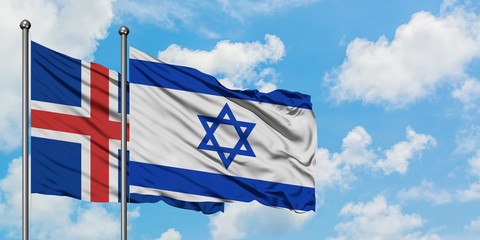 Iceland and Israel flag waving in the wind against white cloudy blue sky together. Diplomacy concept, international relations.