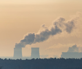 Smoke from the chimneys of a metallurgical plant at dawn