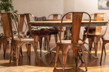 Stylish Vintage Copper color chairs with wooden table
