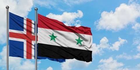 Iceland and Syria flag waving in the wind against white cloudy blue sky together. Diplomacy concept, international relations.