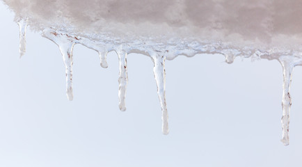 Naklejka na ściany i meble Icicles from ice in winter
