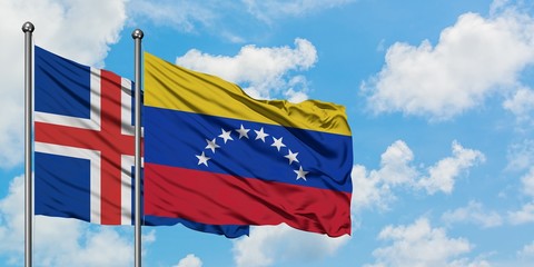 Iceland and Venezuela flag waving in the wind against white cloudy blue sky together. Diplomacy concept, international relations.