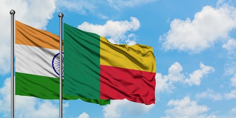 India and Benin flag waving in the wind against white cloudy blue sky together. Diplomacy concept, international relations.
