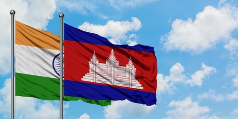 India and Cambodia flag waving in the wind against white cloudy blue sky together. Diplomacy concept, international relations.