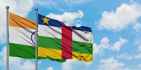 India and Central African Republic flag waving in the wind against white cloudy blue sky together. Diplomacy concept, international relations.