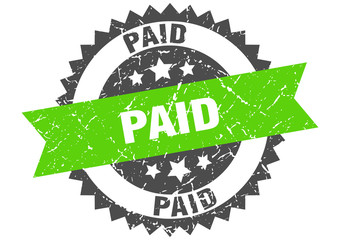 paid grunge stamp with green band. paid