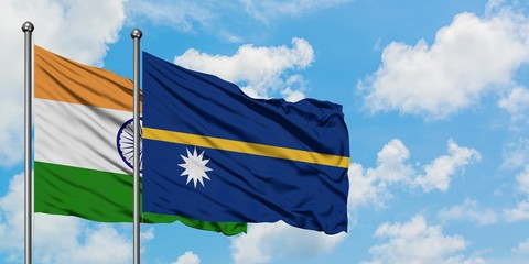 India and Nauru flag waving in the wind against white cloudy blue sky together. Diplomacy concept, international relations.