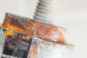 The toilet button in the toilet is covered with hard water. Corrosion.