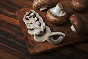 Close up of fresh mushrooms on wooden table