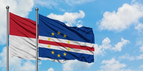 Iraq and Cape Verde flag waving in the wind against white cloudy blue sky together. Diplomacy concept, international relations.