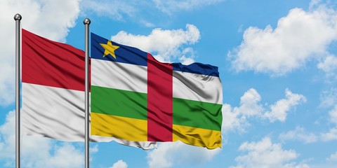 Iraq and Central African Republic flag waving in the wind against white cloudy blue sky together. Diplomacy concept, international relations.