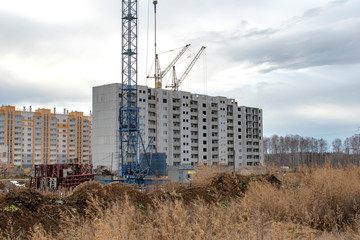 Fototapeta na wymiar construction cranes on the construction site new residential area