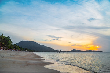 Koh Samui, Thailand - People walking on the beach, sunset