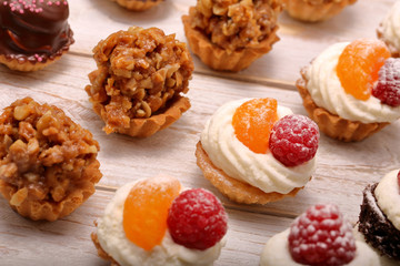 Sweet cookies, closeup of various kinds of cakes on event or wedding reception