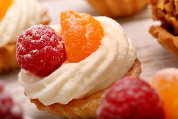 Sweet cream cookies with raspberries and tangerines