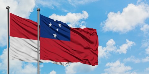 Iraq and Samoa flag waving in the wind against white cloudy blue sky together. Diplomacy concept,...