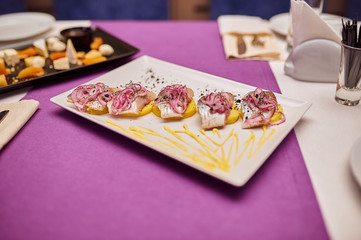 Delicious sliced ​​iblini with caviar