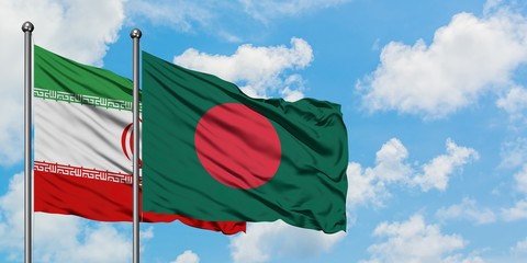 Iran and Bangladesh flag waving in the wind against white cloudy blue sky together. Diplomacy concept, international relations.