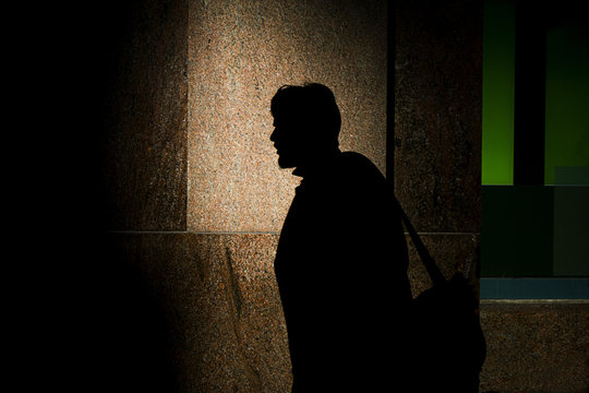 Silhouette of man near the building
