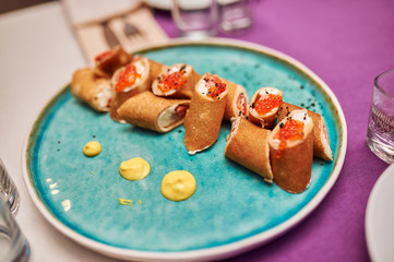 Delicious sliced ​​iblini with caviar