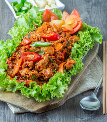 Set of stir fried pork in korean traditional style in hot pan serve with slide dish, rice and seaweed soup,.