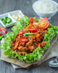 Set of stir fried pork in korean traditional style in hot pan serve with slide dish, rice and seaweed soup,.