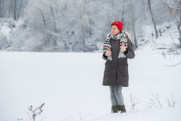 Portrait of young man in winter landscape