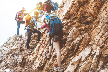 Hiking team, teamwork concept, successful team, successful team standing on the top of the...