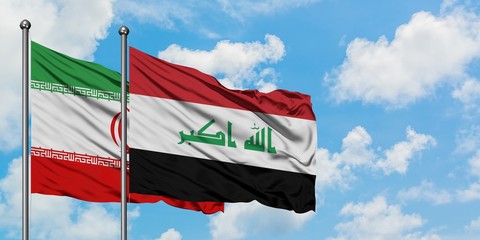 Iran and Iraq flag waving in the wind against white cloudy blue sky together. Diplomacy concept, international relations.