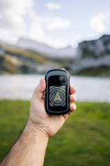 Hands with mountain GPS