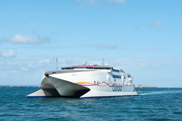 Fototapeta na wymiar the Condor ferry arrives in the port of Saint-Malo on the coast of Brittany