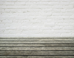 white brick wall and wood floor