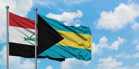 Iraq and Bahamas flag waving in the wind against white cloudy blue sky together. Diplomacy concept, international relations.