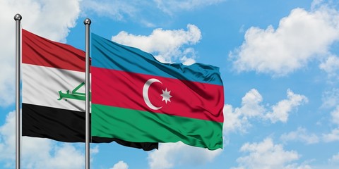 Iraq and Azerbaijan flag waving in the wind against white cloudy blue sky together. Diplomacy concept, international relations.