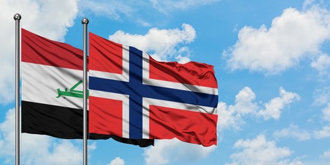 Iraq and Bouvet Islands flag waving in the wind against white cloudy blue sky together. Diplomacy concept, international relations.