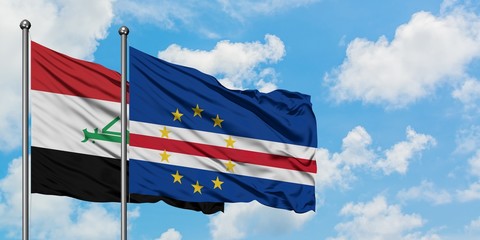 Iraq and Cape Verde flag waving in the wind against white cloudy blue sky together. Diplomacy...