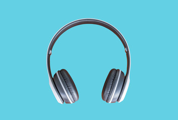 Fototapeta na wymiar White wireless Headphones on blue background