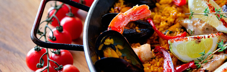 Delicious Spanish seafood paella panoramic view from top