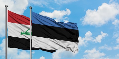 Iraq and Estonia flag waving in the wind against white cloudy blue sky together. Diplomacy concept, international relations.